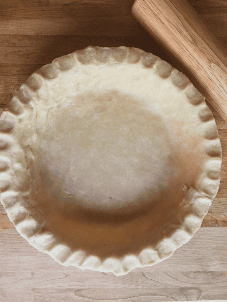 pie crust with rolling pin to the upper right